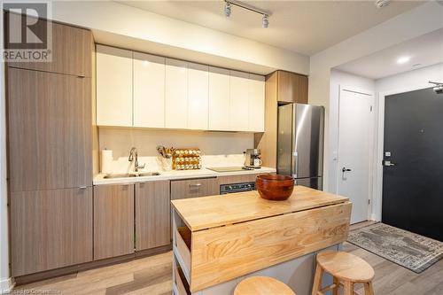 5230 Dundas Street Unit# A428, Burlington, ON - Indoor Photo Showing Kitchen With Double Sink