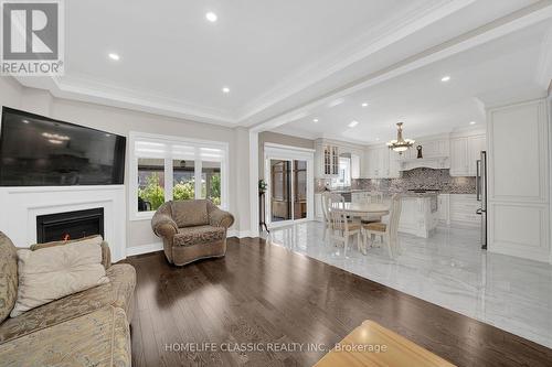 105 Mckenzie Way, Bradford West Gwillimbury, ON - Indoor Photo Showing Living Room With Fireplace