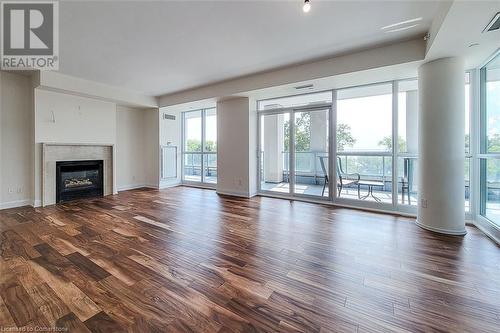 11 Bronte Road Unit# 323, Oakville, ON - Indoor Photo Showing Living Room With Fireplace