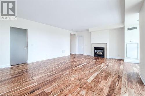 11 Bronte Road Unit# 323, Oakville, ON - Indoor Photo Showing Living Room With Fireplace