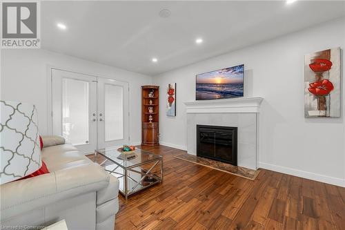 Family room with wood fireplace - 15414 Niagara River Parkway, Niagara-On-The-Lake, ON - Indoor Photo Showing Living Room With Fireplace