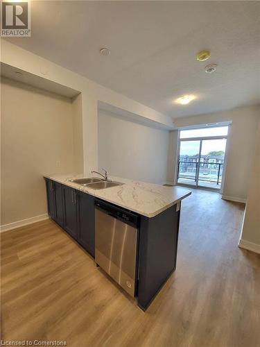 Kitchen Island - 600 North Service Road Unit# 424, Hamilton, ON - Indoor Photo Showing Kitchen With Double Sink