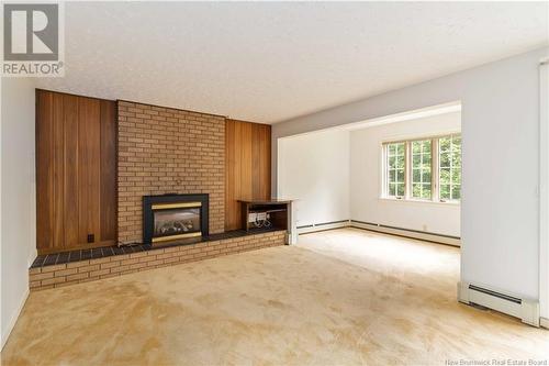 297 Wright Street, Fredericton, NB - Indoor Photo Showing Living Room With Fireplace