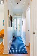 Bright front hallway with recent front door. - 