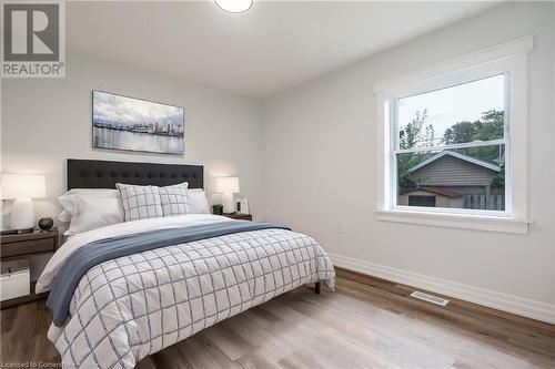 virtually staged bedroom 1 - 16 Wildewood Avenue, Hamilton, ON - Indoor Photo Showing Bedroom