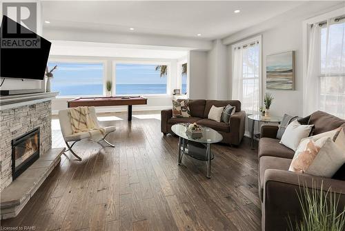 2952 North Shore Drive, Lowbanks, ON - Indoor Photo Showing Living Room With Fireplace