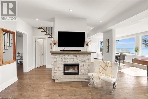 2952 North Shore Drive, Lowbanks, ON - Indoor Photo Showing Living Room With Fireplace