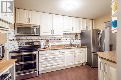 6 Niagara Street Unit# 105, Grimsby, ON - Indoor Photo Showing Kitchen With Double Sink