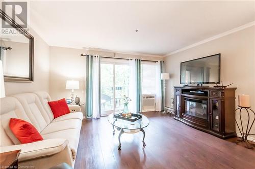 6 Niagara Street Unit# 105, Grimsby, ON - Indoor Photo Showing Living Room With Fireplace