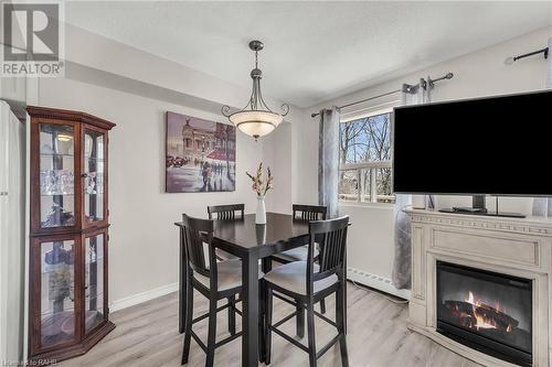 793 Colborne Street Unit# 217, Brantford, ON - Indoor Photo Showing Dining Room With Fireplace