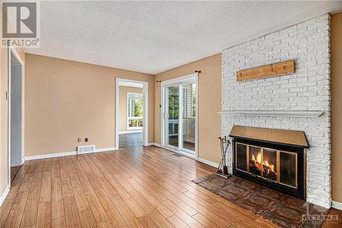 1407 Laurin Crescent, Ottawa, ON - Indoor Photo Showing Living Room With Fireplace