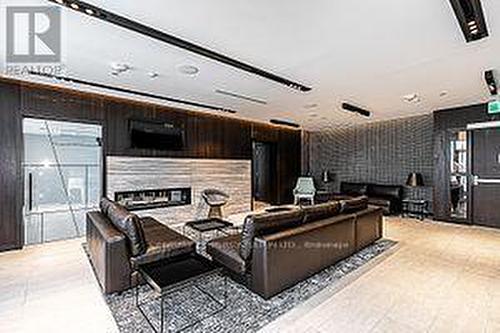 405 - 6 Sonic Way, Toronto, ON - Indoor With Fireplace