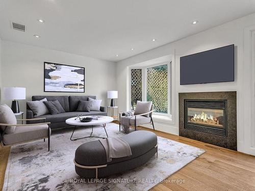 130 Three Valleys Dr, Toronto, ON - Indoor Photo Showing Living Room With Fireplace