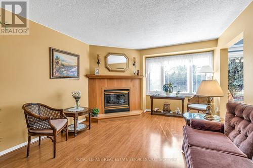 74 - 2275 Credit Valley Road, Mississauga, ON - Indoor Photo Showing Living Room With Fireplace