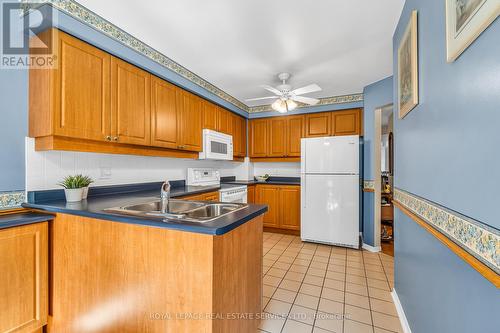 74 - 2275 Credit Valley Road, Mississauga (Central Erin Mills), ON - Indoor Photo Showing Kitchen With Double Sink