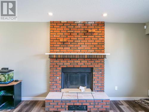 489 Adam Street, Quesnel, BC - Indoor Photo Showing Living Room With Fireplace