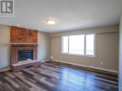 489 Adam Street, Quesnel, BC - Indoor Photo Showing Living Room With Fireplace