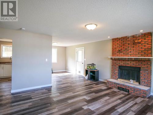 489 Adam Street, Quesnel, BC - Indoor Photo Showing Living Room With Fireplace