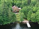 Vue d'ensemble - 42 Ch. Des Mauves, La Minerve, QC  - Outdoor With Body Of Water With Deck Patio Veranda 