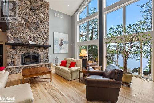 1827 Crystal Lake Road, Trent Lakes, ON - Indoor Photo Showing Living Room With Fireplace