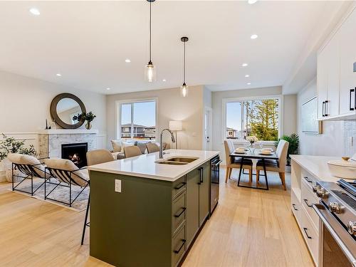 1538 Marble Pl, Langford, BC - Indoor Photo Showing Kitchen With Fireplace With Double Sink With Upgraded Kitchen