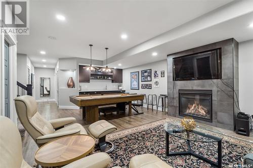 711 8Th Avenue N, Saskatoon, SK - Indoor Photo Showing Living Room With Fireplace