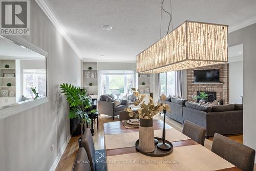 27 Dorvis Drive, Whitby (Blue Grass Meadows), ON - Indoor Photo Showing Dining Room With Fireplace