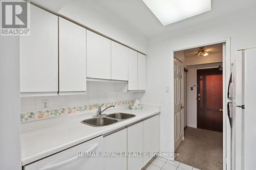 714 - 50 Kingsbridge Garden Circle, Mississauga (Hurontario), ON - Indoor Photo Showing Kitchen With Double Sink