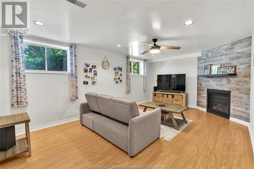 3672 Deerbrook, Windsor, ON - Indoor Photo Showing Living Room With Fireplace