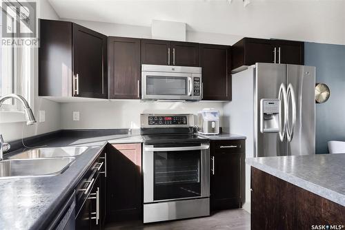 5109 Beacon Way, Regina, SK - Indoor Photo Showing Kitchen With Stainless Steel Kitchen With Double Sink