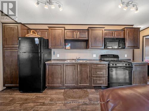 319 - 1501 Line 8 Road, Niagara-On-The-Lake, ON - Indoor Photo Showing Kitchen With Double Sink