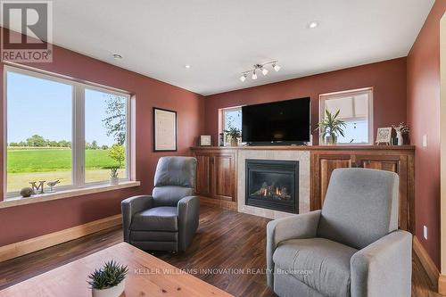 143 West Street, North Perth, ON - Indoor Photo Showing Living Room With Fireplace