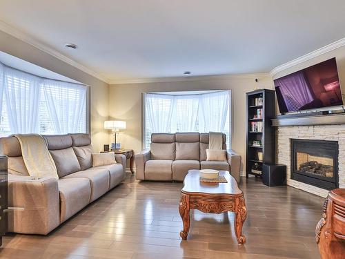 Living room - 101-82 Rue Bruno-Dion, Blainville, QC - Indoor Photo Showing Living Room With Fireplace