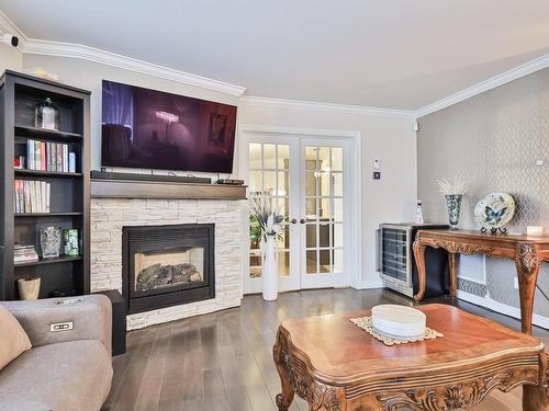 Living room - 101-82 Rue Bruno-Dion, Blainville, QC - Indoor Photo Showing Living Room With Fireplace