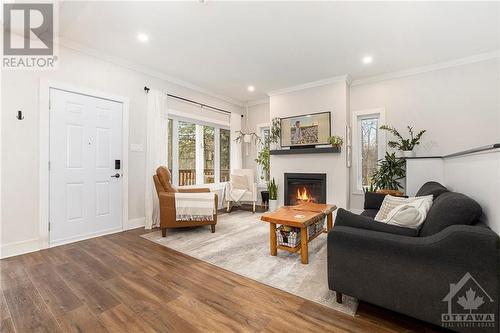 734 Powers Road, Perth, ON - Indoor Photo Showing Living Room With Fireplace