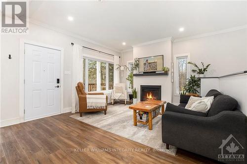 734 Powers Road, Tay Valley, ON - Indoor Photo Showing Living Room With Fireplace