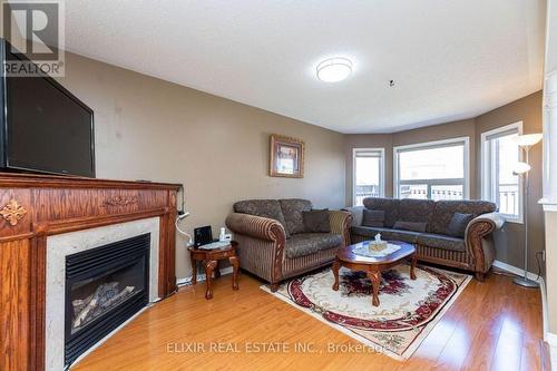 14 Passfield Trail, Brampton, ON - Indoor Photo Showing Living Room With Fireplace