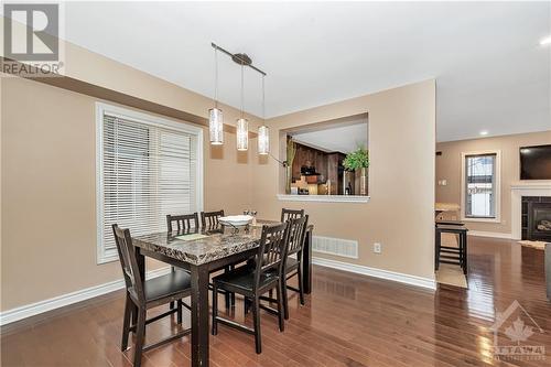 3121 Burritts Rapids Place, Ottawa, ON - Indoor Photo Showing Dining Room With Fireplace