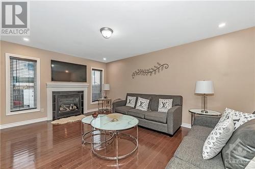 3121 Burritts Rapids Place, Ottawa, ON - Indoor Photo Showing Living Room With Fireplace