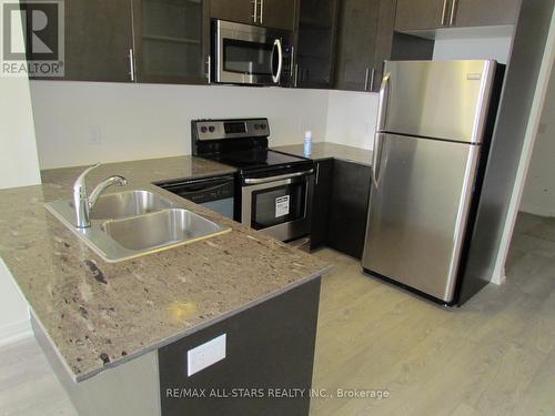 305 - 9500 Markham Road, Markham, ON - Indoor Photo Showing Kitchen With Stainless Steel Kitchen With Double Sink With Upgraded Kitchen