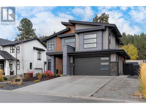 2 car garage plus side parking for the suite, if desired - 4315 Ladd Court, Kelowna, BC - Outdoor With Facade