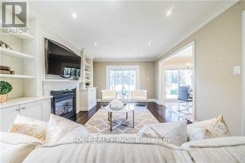 76 Abbeywood Trail, Toronto, ON - Indoor Photo Showing Living Room With Fireplace