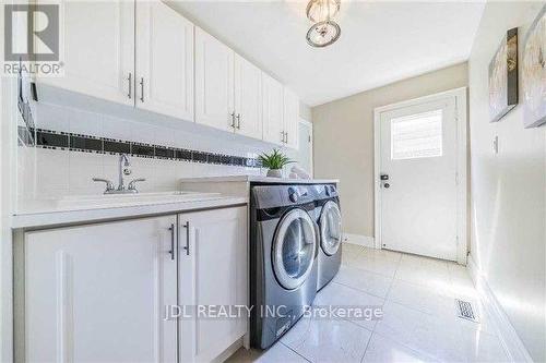 76 Abbeywood Trail, Toronto, ON - Indoor Photo Showing Laundry Room