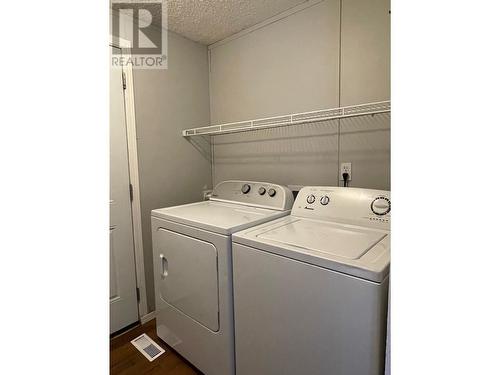 27 5701 Airport Drive, Fort Nelson, BC - Indoor Photo Showing Laundry Room