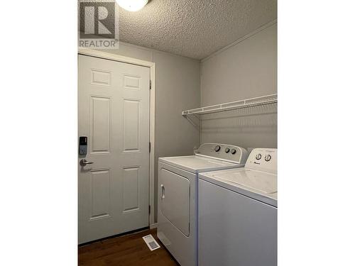 27 5701 Airport Drive, Fort Nelson, BC - Indoor Photo Showing Laundry Room