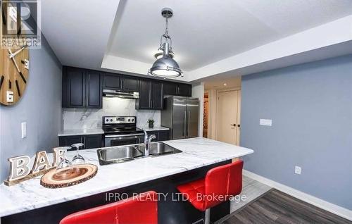 10 - 100 Dufay Road, Brampton, ON - Indoor Photo Showing Kitchen With Double Sink