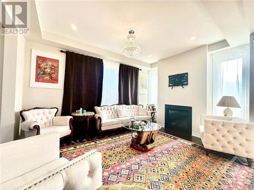 700 Brittanic Road, Kanata (9010 - Kanata - Emerald Meadows/Trailwest), ON - Indoor Photo Showing Living Room With Fireplace