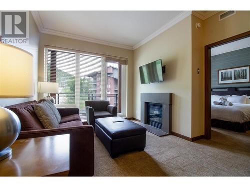 2950 Camozzi Road Unit# 1413, Revelstoke, BC - Indoor Photo Showing Living Room With Fireplace