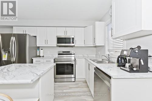 50 - 7768 Ascot Circle, Niagara Falls, ON - Indoor Photo Showing Kitchen With Double Sink