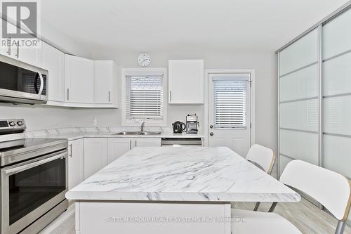 50 - 7768 Ascot Circle, Niagara Falls, ON - Indoor Photo Showing Kitchen With Double Sink